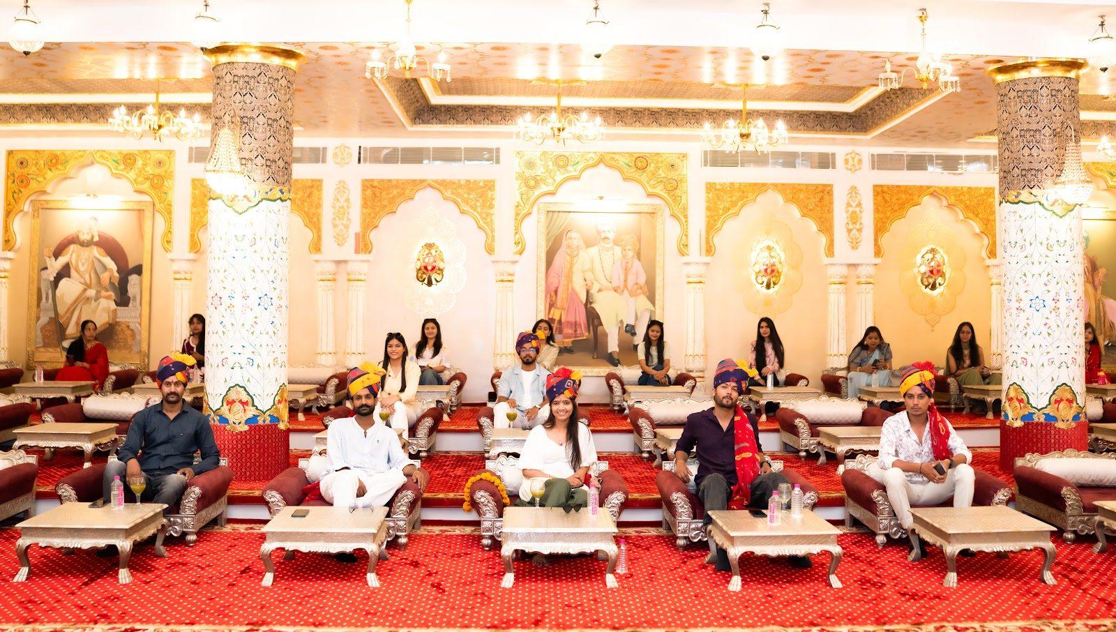 Guests seated in the grand darbar hall